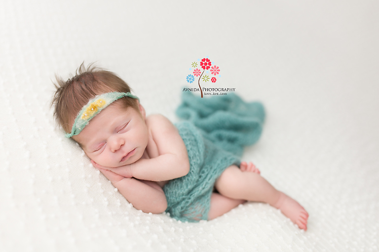 Jersey City NJ Newborn Photographer - Like a little mermaid, this little girl dons her green dress