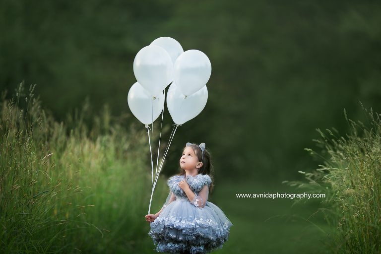 children's couture photography - Wondering what journey the balloons will take her next to?